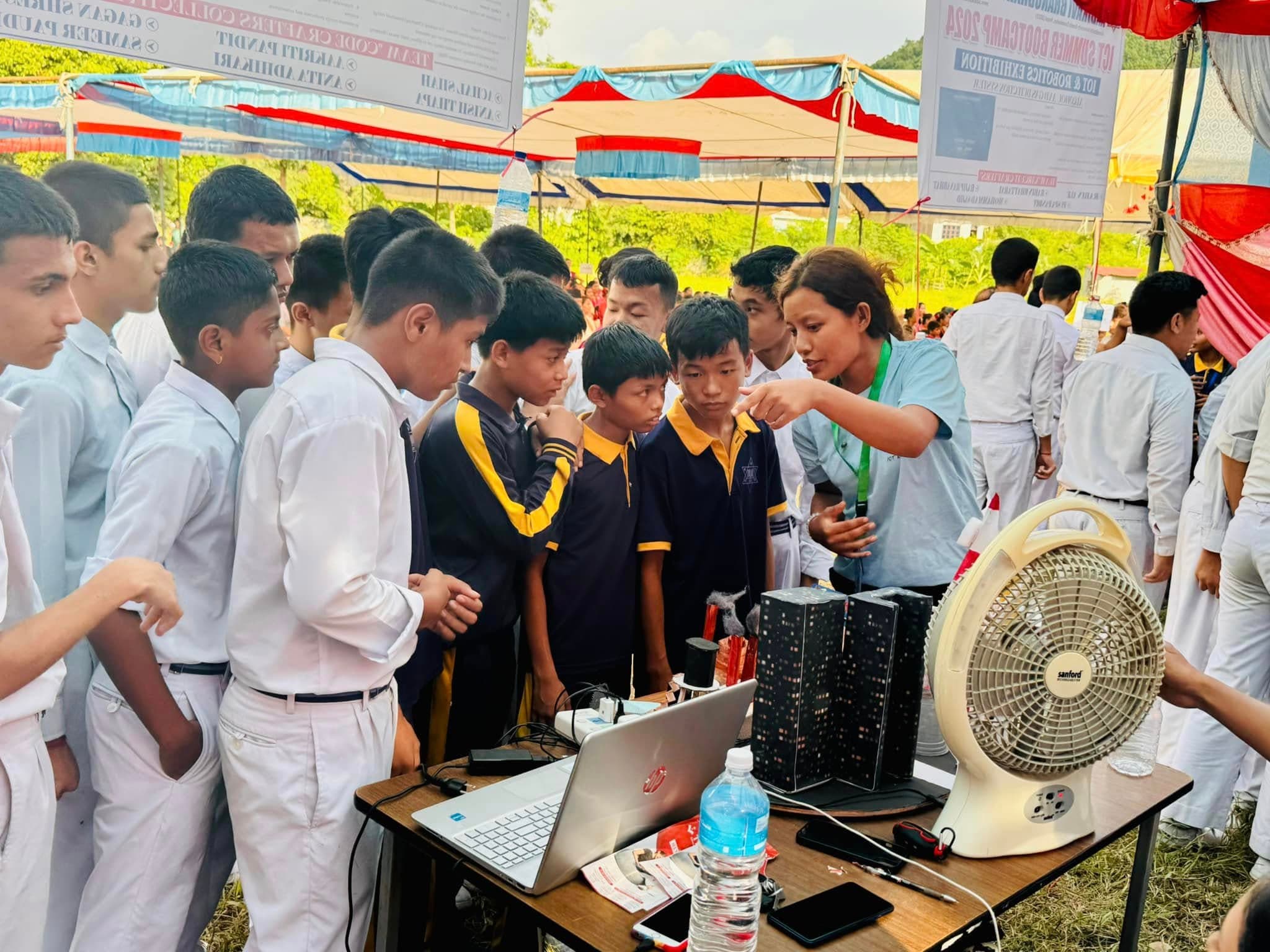 Students showcasing projects at the IoT & Robotics exhibition