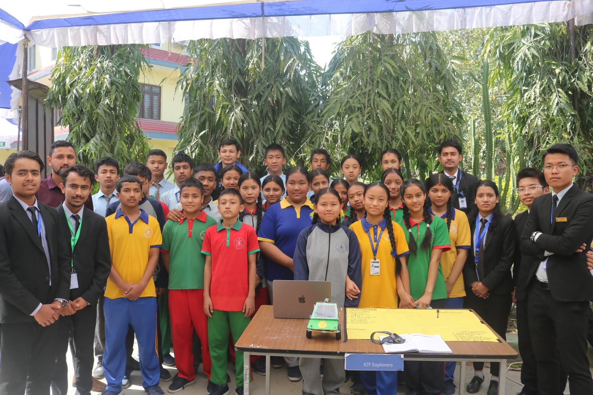 The IoT Explorers team with visiting students from another school at the exhibition