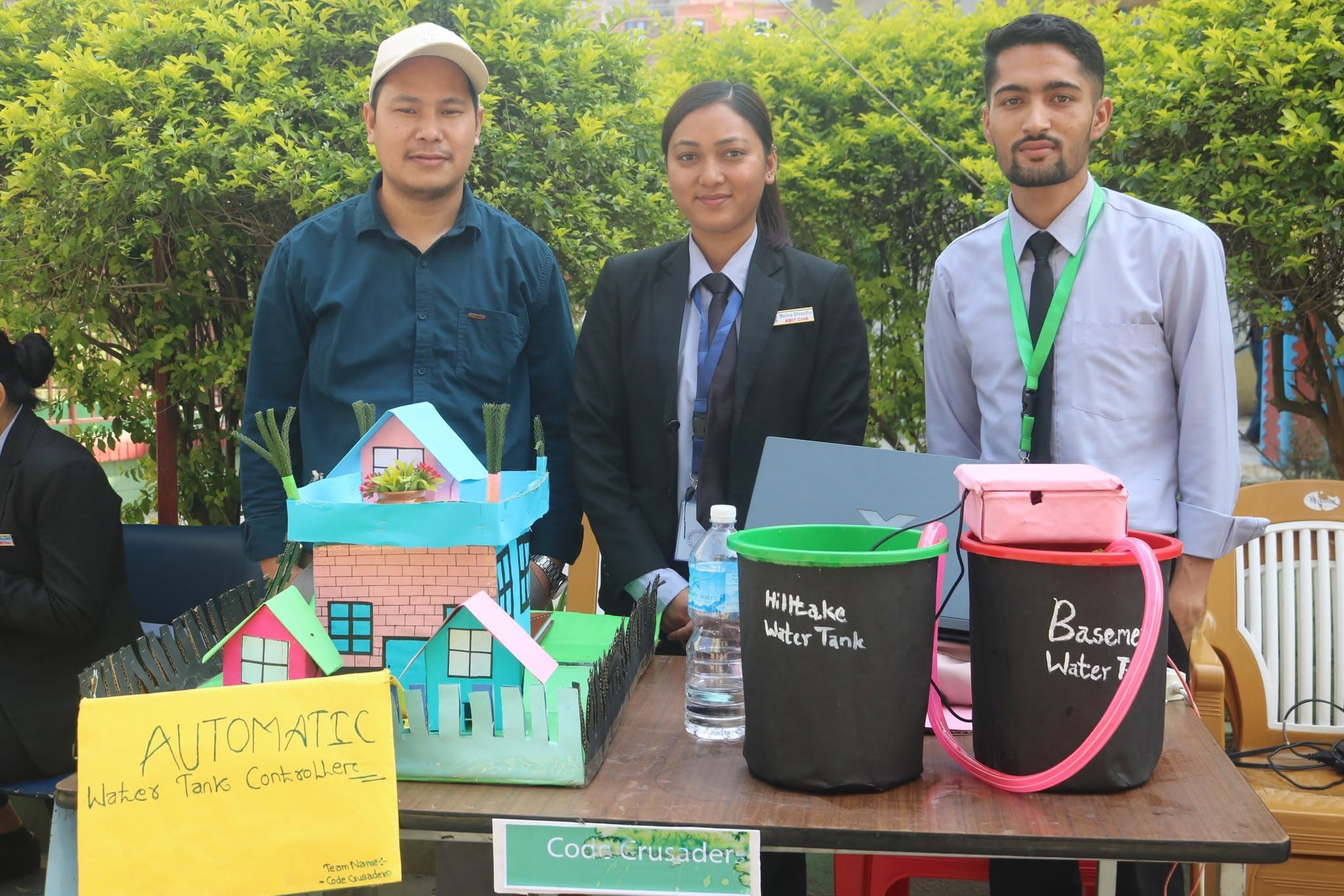Team Code Crusaders with their automatic water tank controller