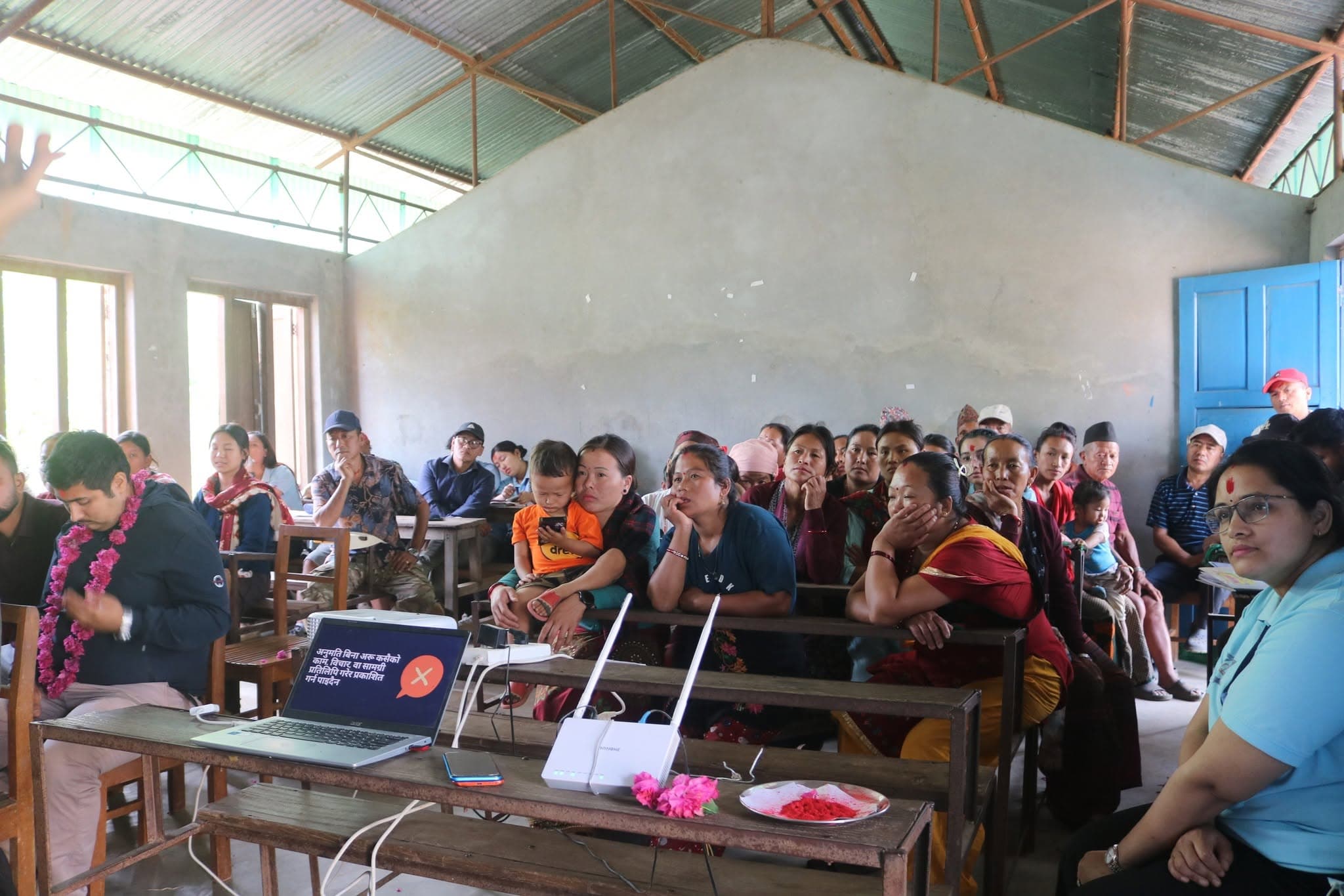 Villagers gathered in the community hall for the presentation