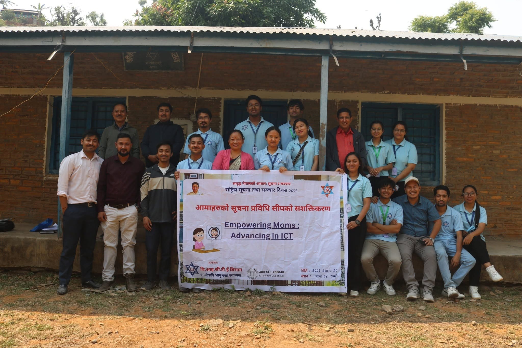 Students and teachers with the Empowering Moms banner