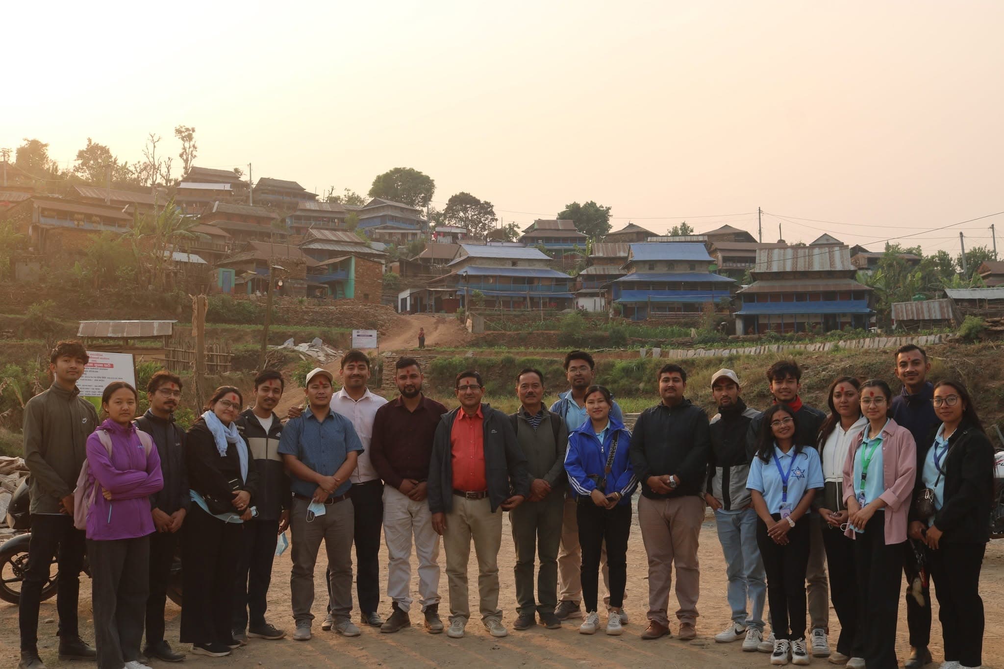 The full group with Rumsi village in the background