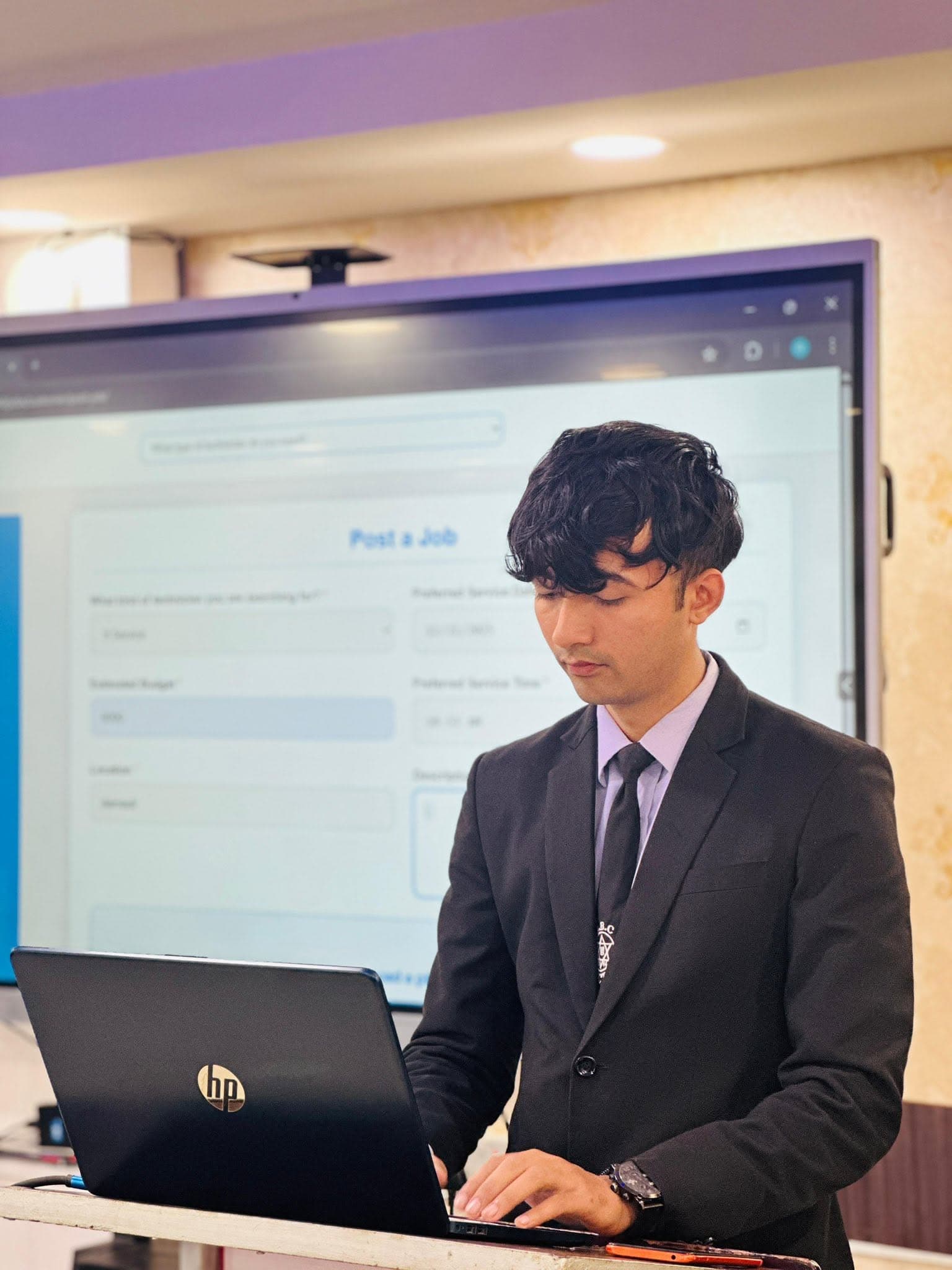 A student presenting his project at the podium — 2078 batch