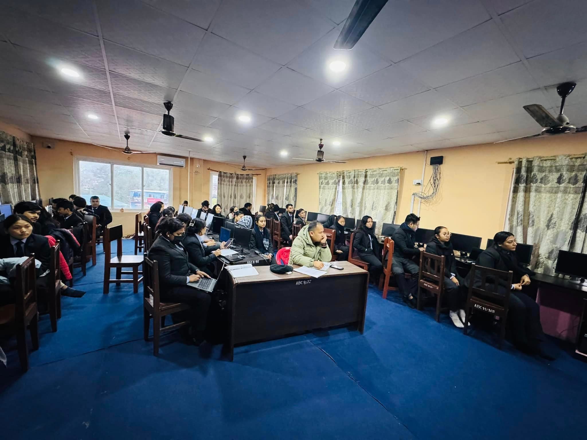 The full cohort and BICTE faculty listening to one of the presentations