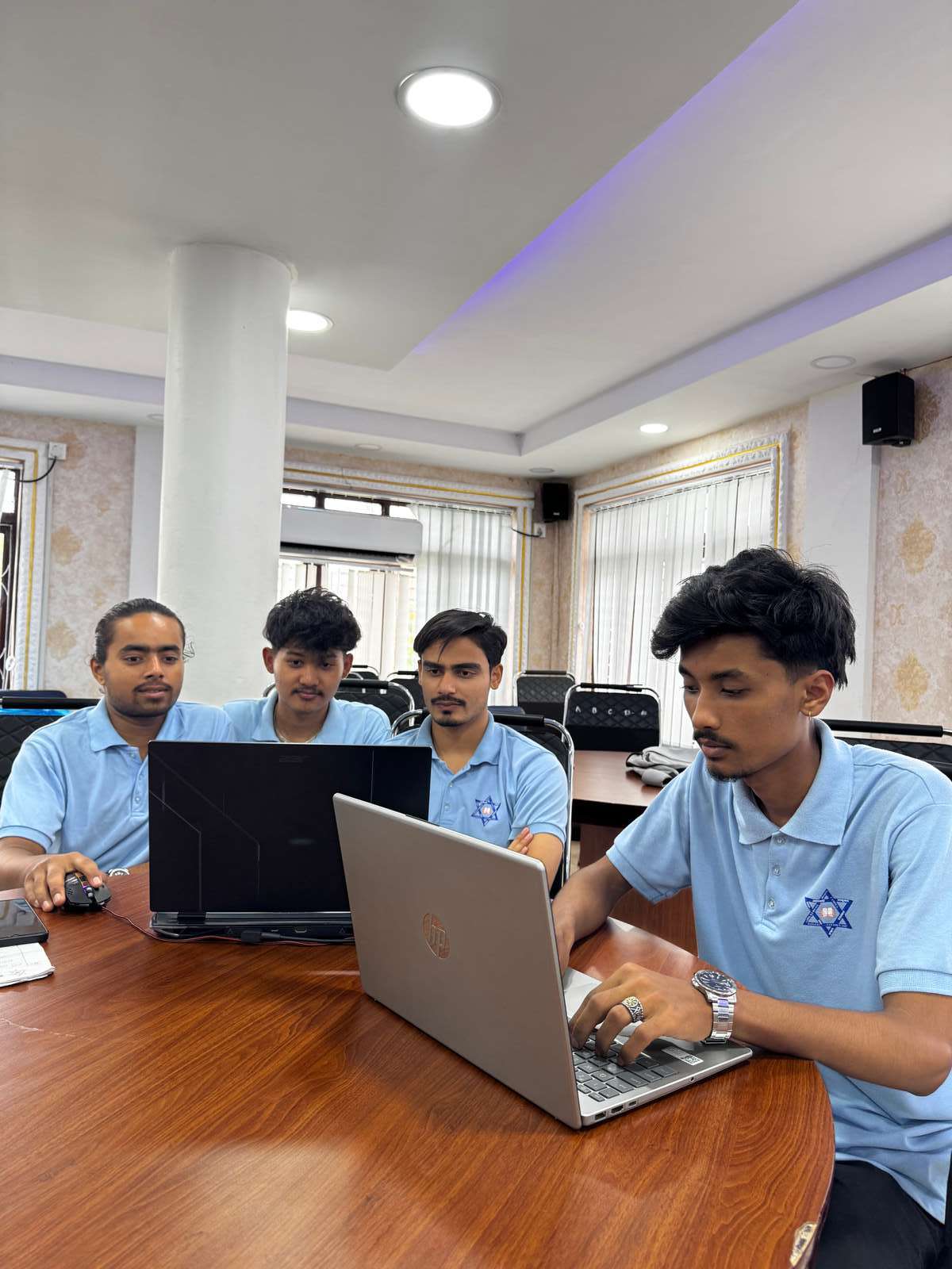 Participants working together on laptops during the session