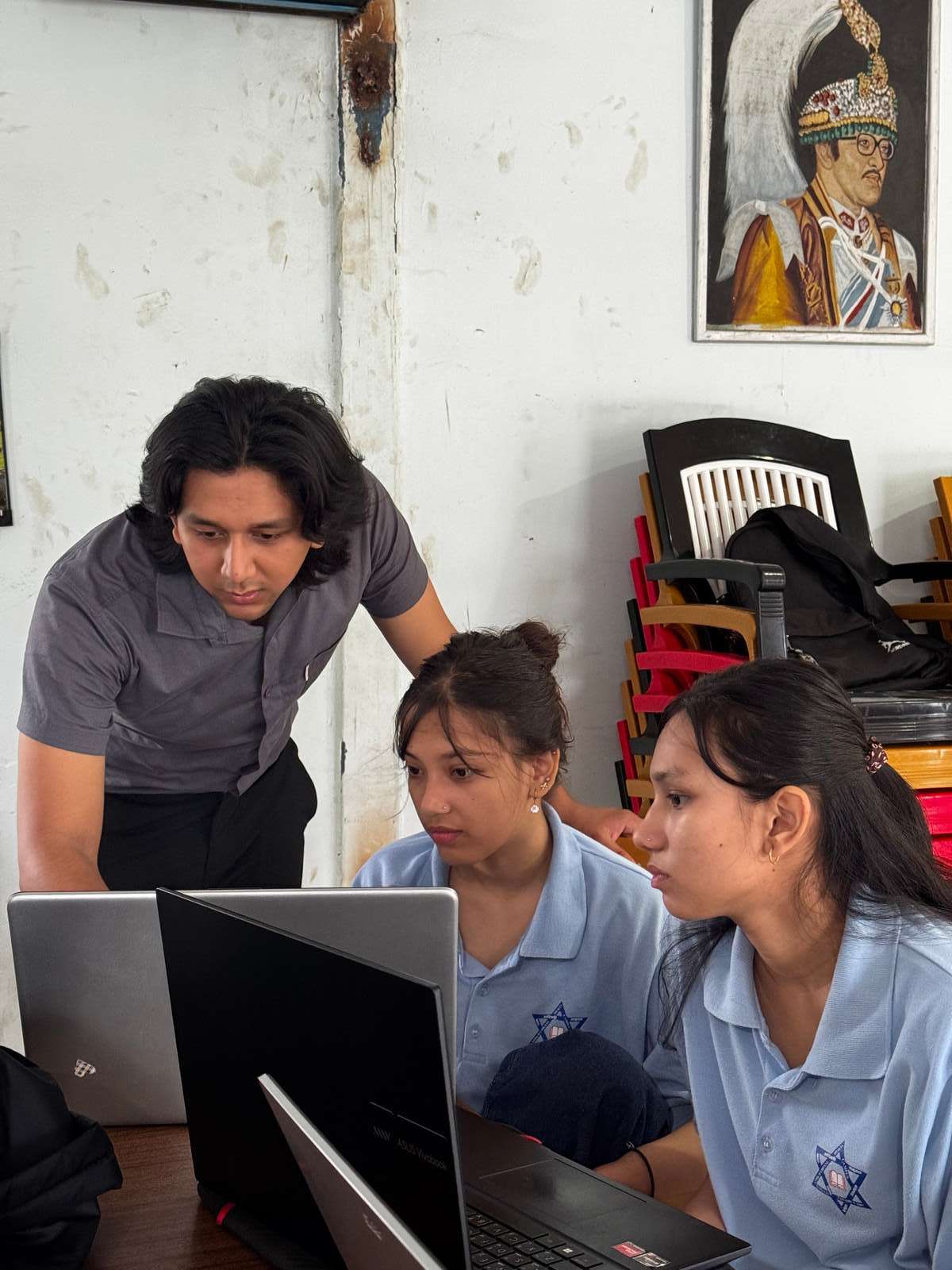 A mentor guiding students through a Next.js coding session