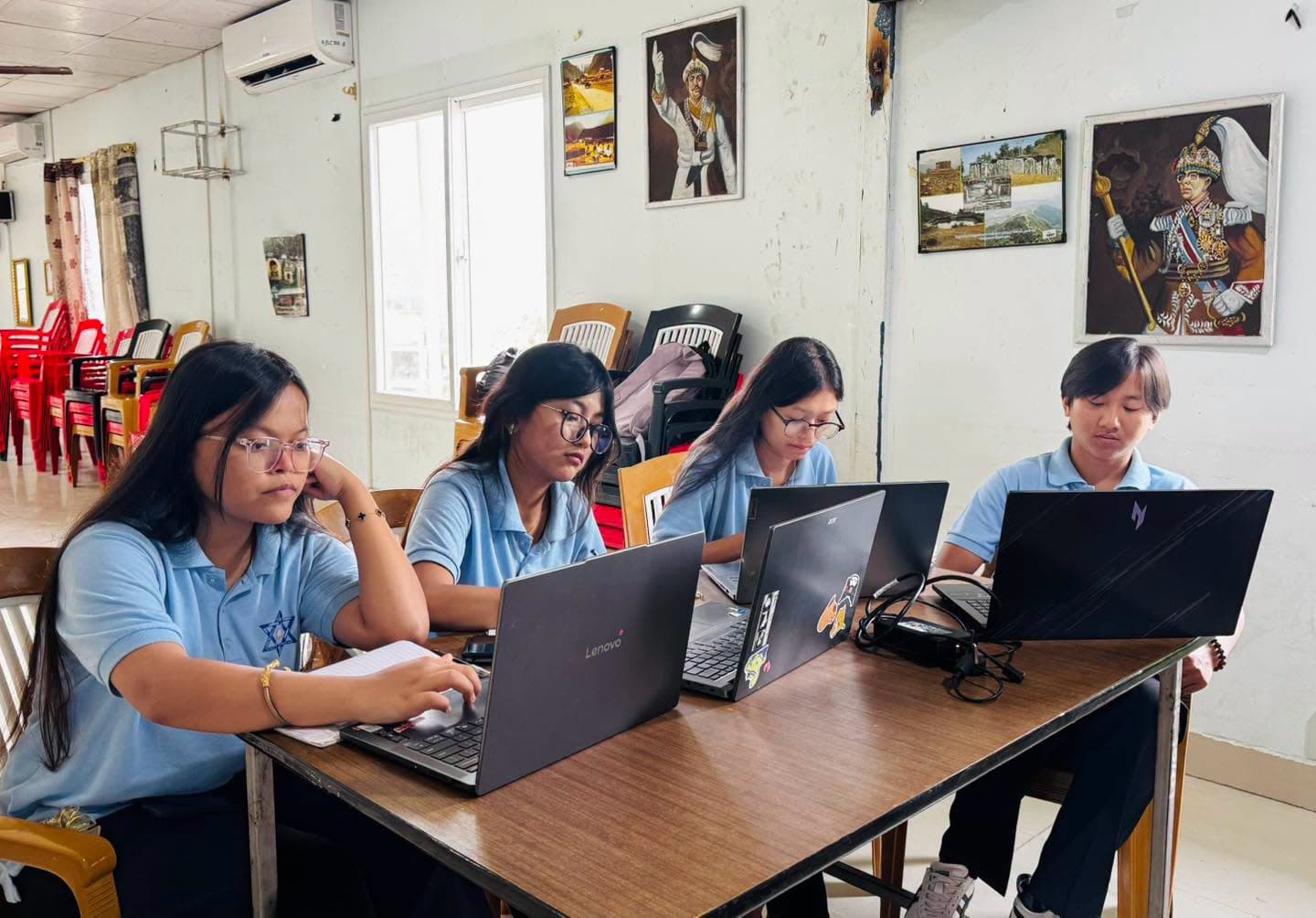 Students working through the exercises on their laptops