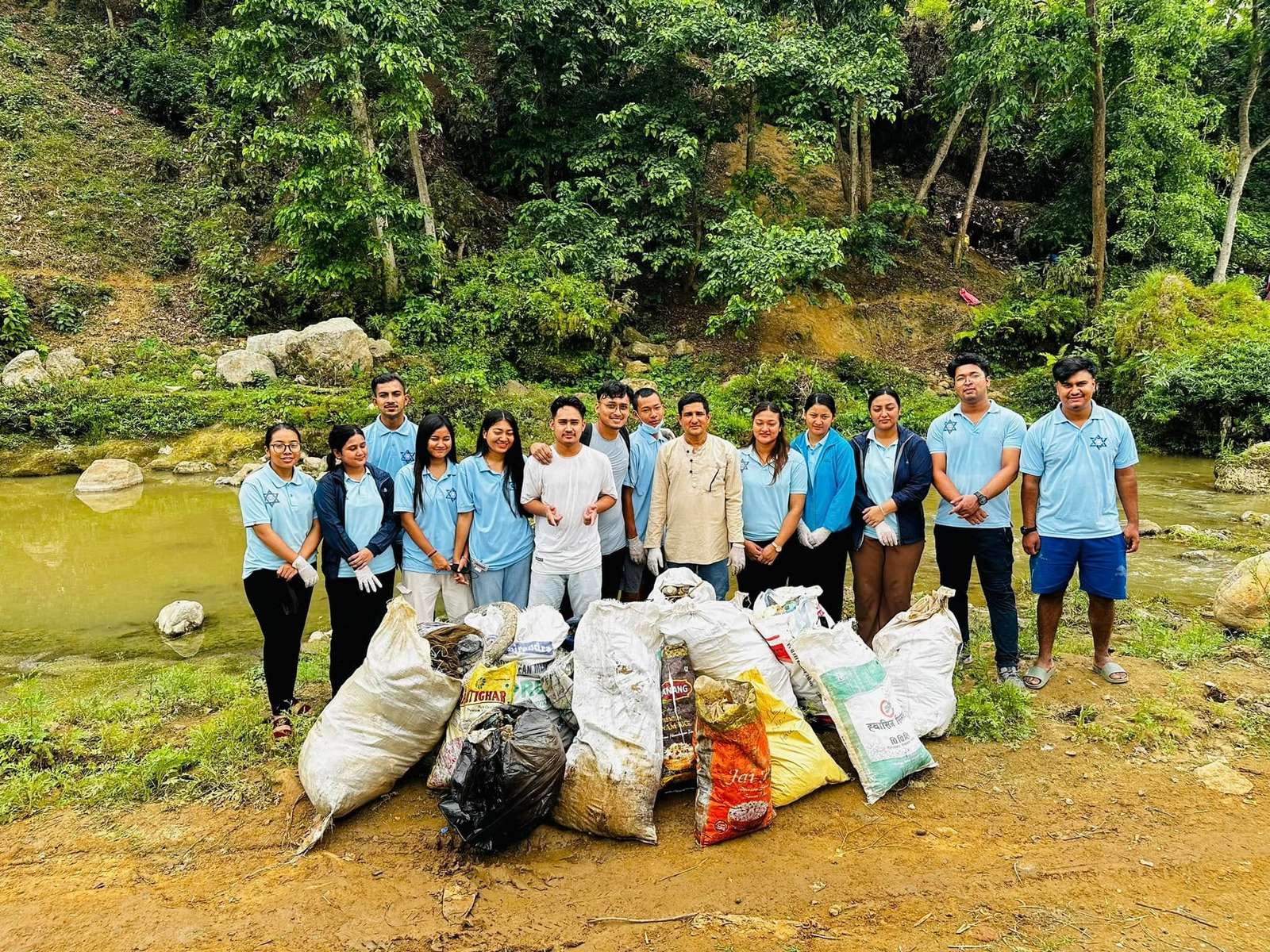 The team with the sacks of waste cleared from the river
