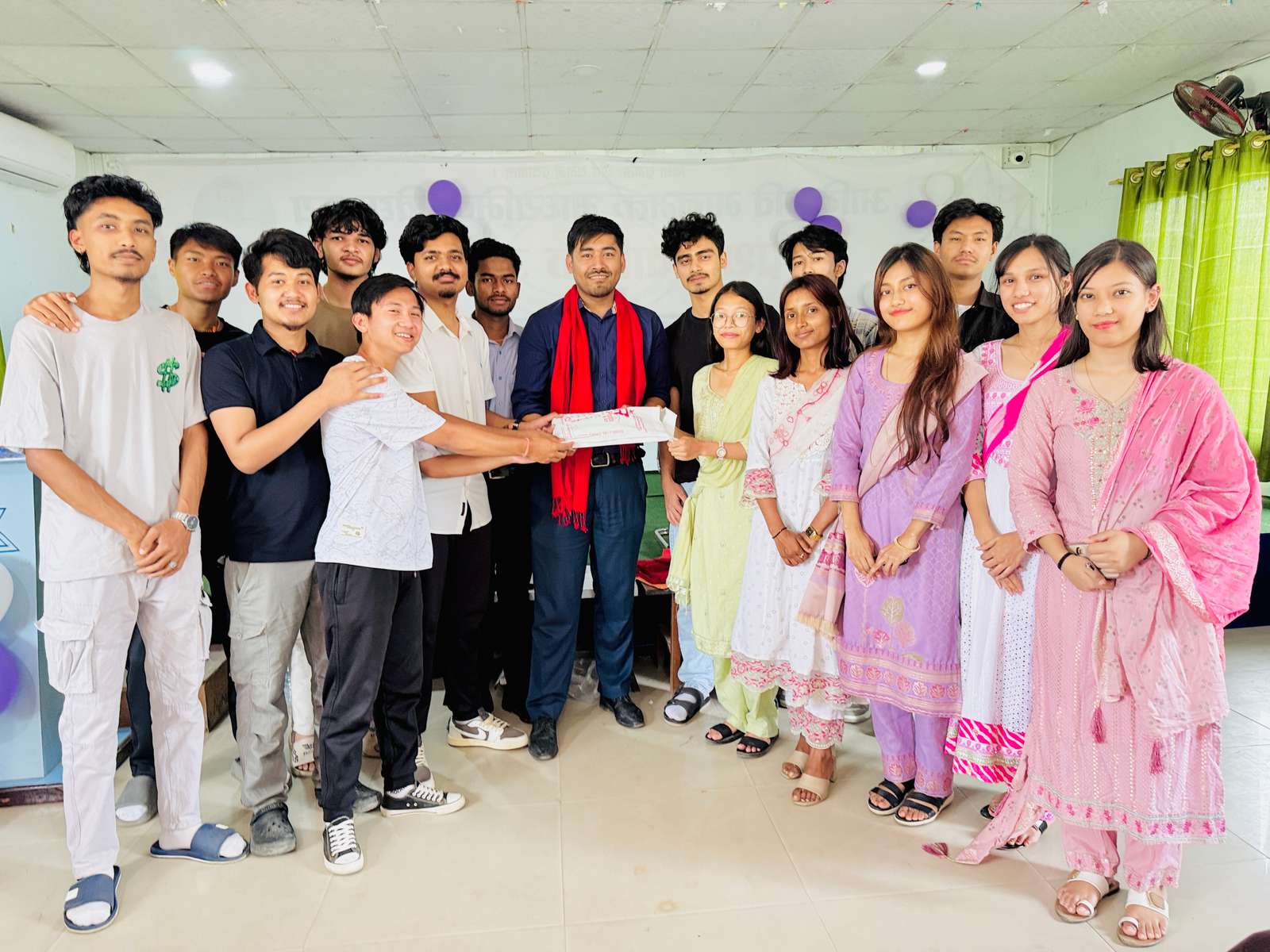 Receiving a farewell gift from one of his classes