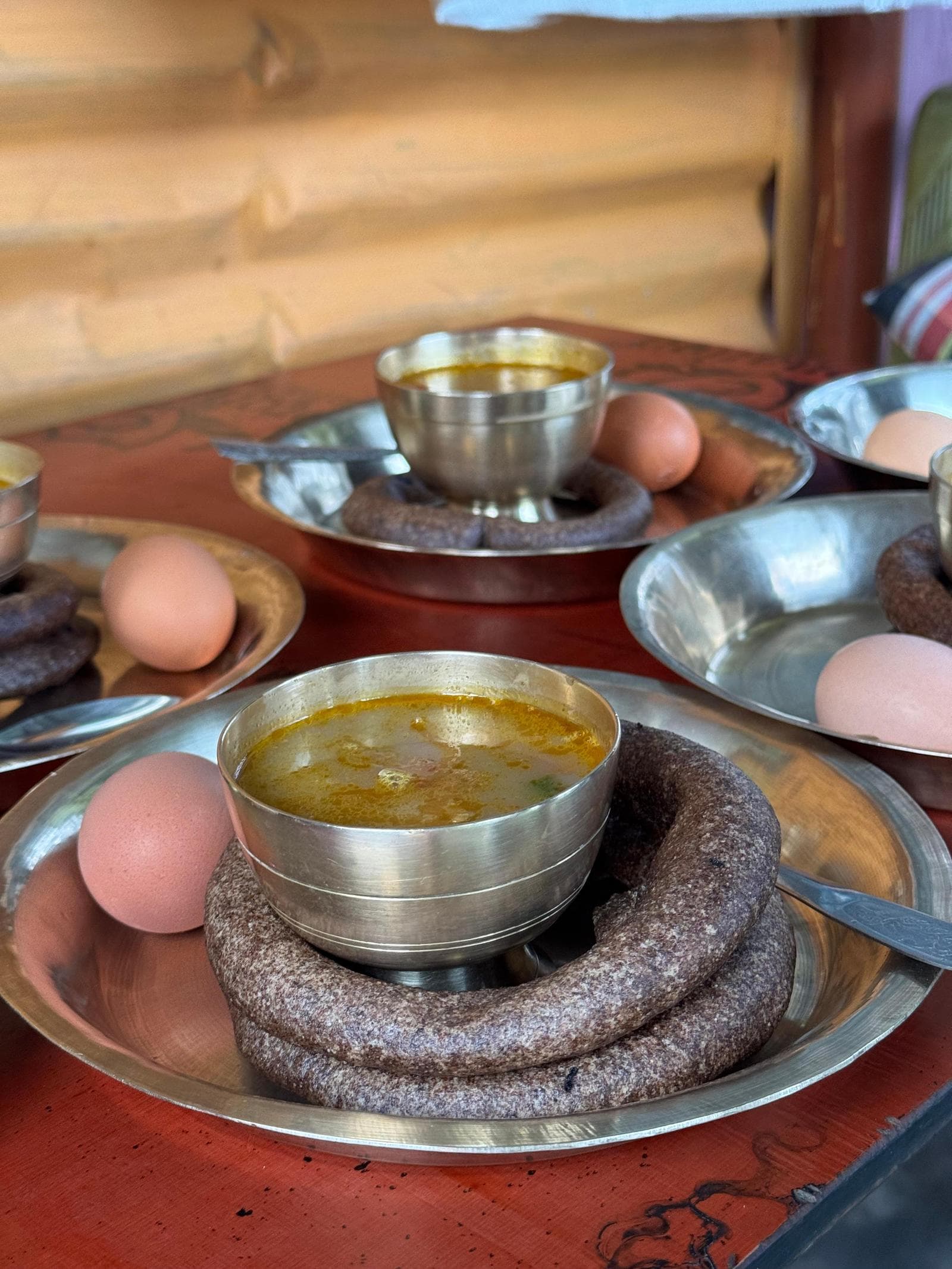 Finger Millet Sel Roti, soup and local eggs served at the homestay