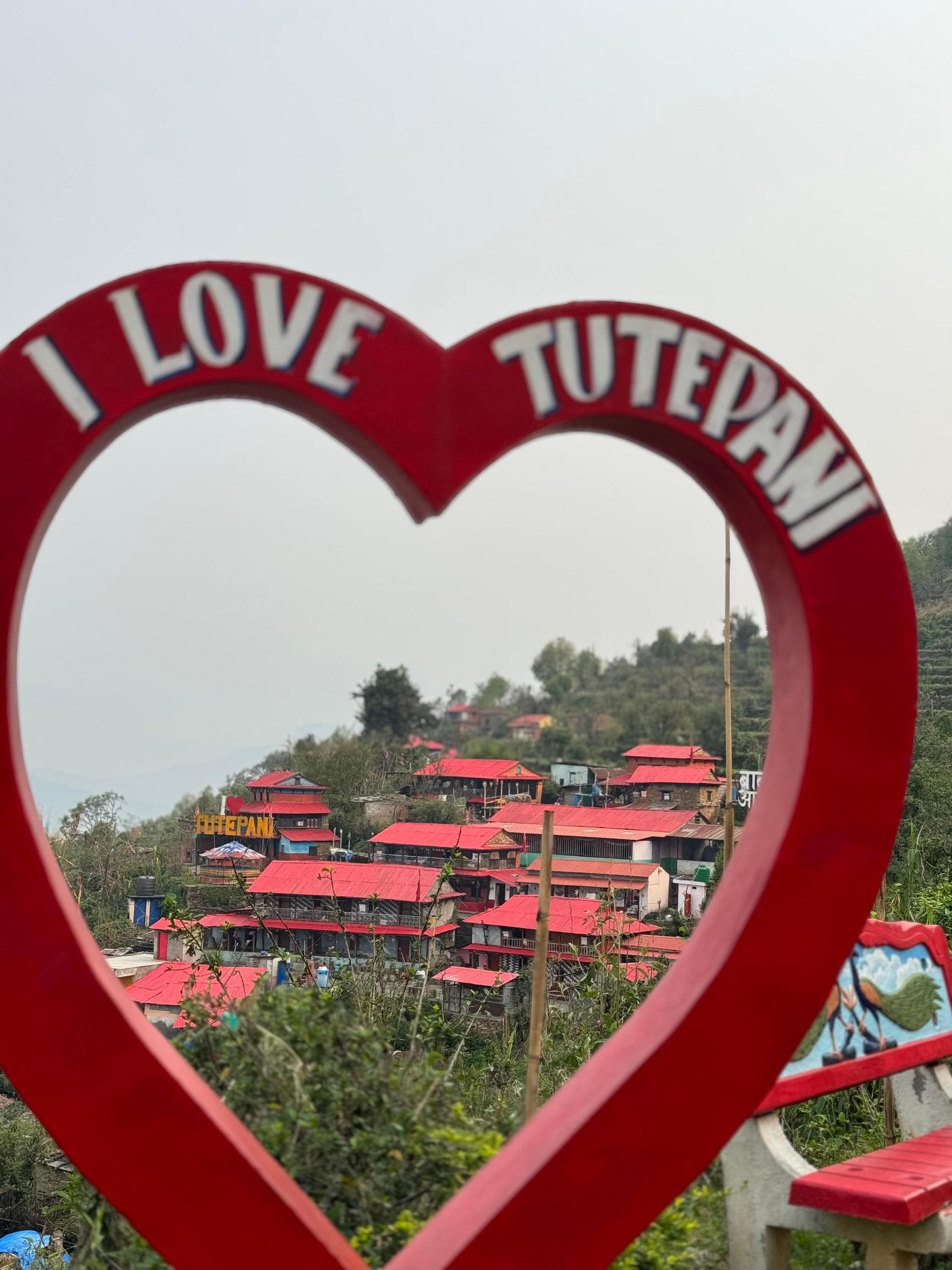 The village seen through the I Love TutePani frame